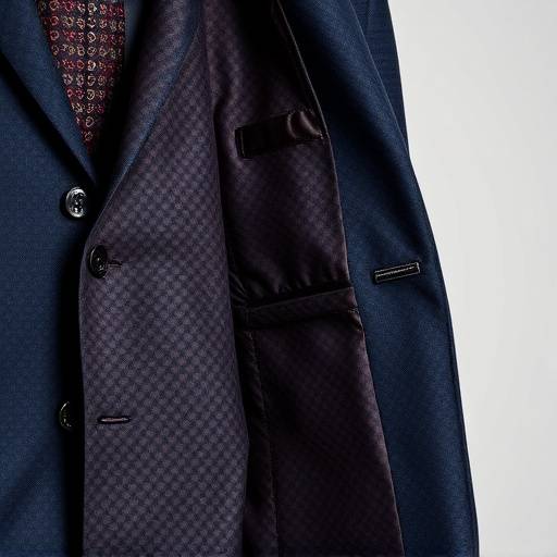 A bespoke suit jacket with intricate lining pattern